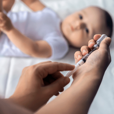 Baby receiving childhood vaccinations